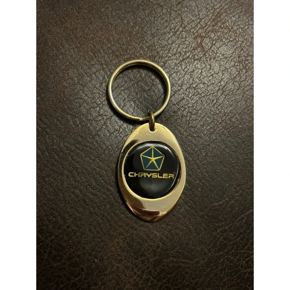 Vintage Chrysler keychain from 1995 gold color
